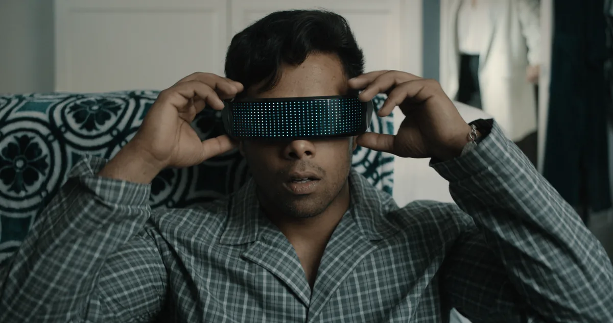 A man wearing a glowing VR visor in a scene from PROXY.
